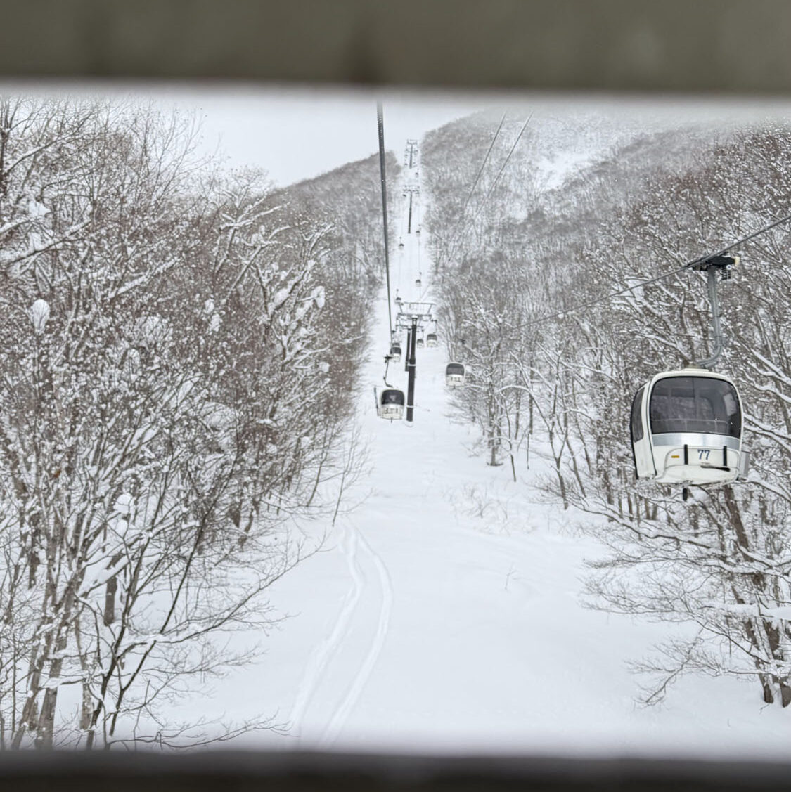 Hirafu gondola ascent in Niseko ski resort with scenic mountain views on BSSC’s Japan 2026 trip.
